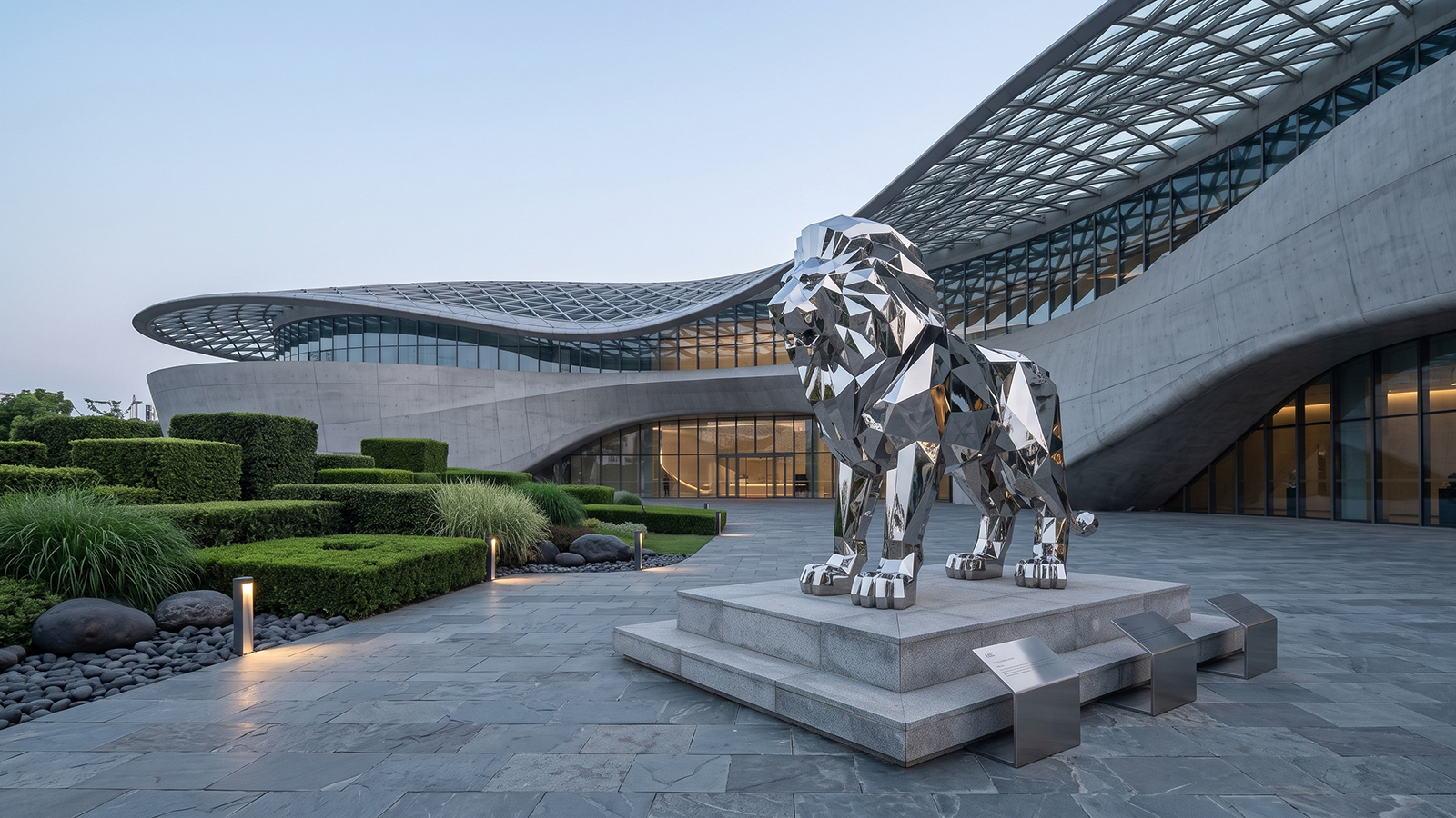 Large geometric stainless steel lion sculpture with mirror polished faceted surface for commercial entrance and outdoor decoration.